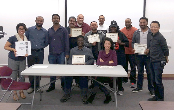 Photo of members of a Contractor Academy workshop with their completion certificate