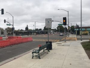sidewalk with a bench